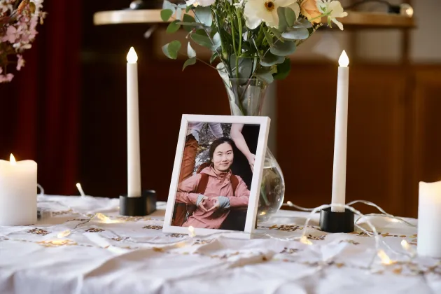 Photo and candle on a desk