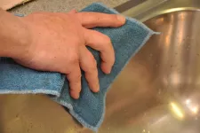 Hand cleaning the sink