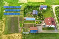Aearial view of a private house in summer with grass and solar panels