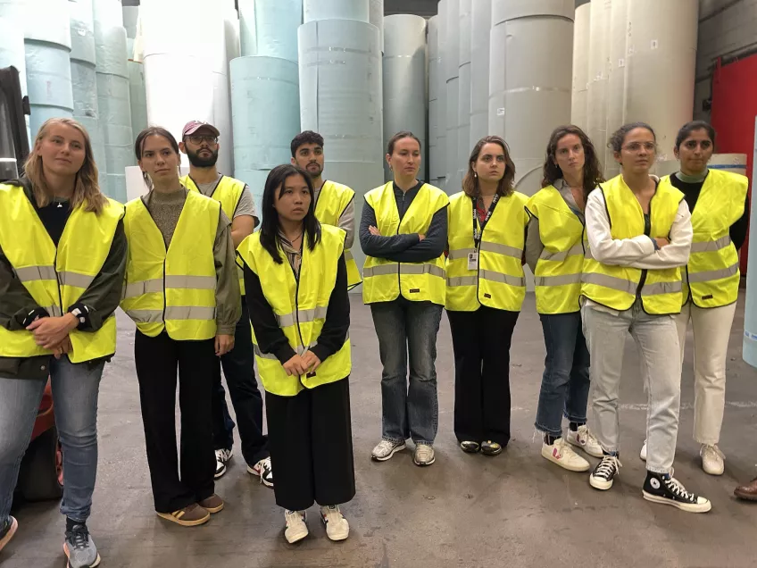 Group of people in yellow vests at a company site