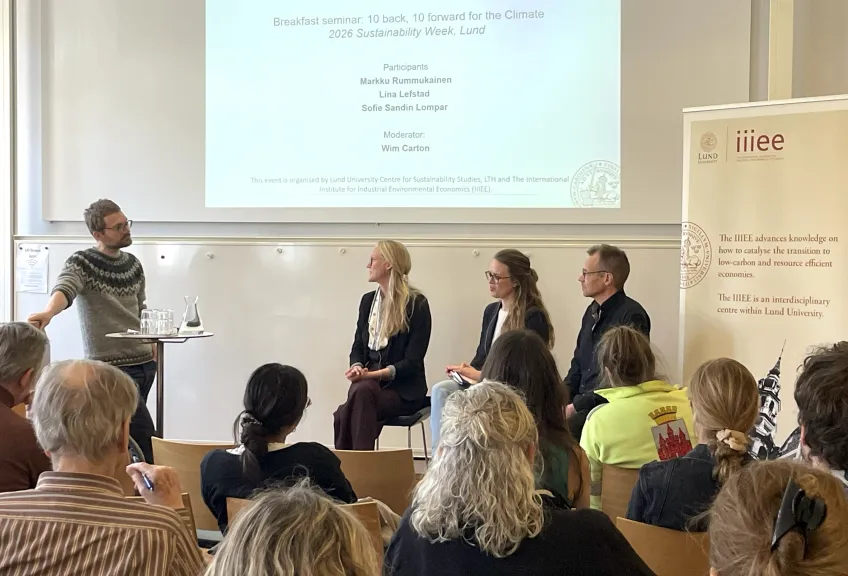 Panelists, moderator and audience in a seminar